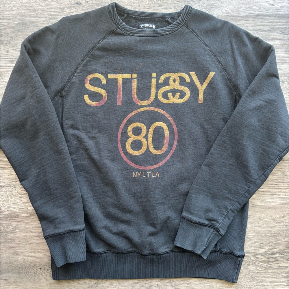 Vintage Stussy Men's Black Crewneck Sweater with Gold Print